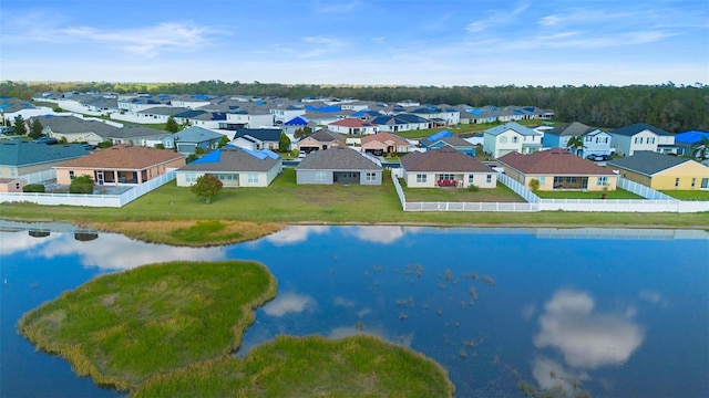 bird's eye view featuring a water view and a residential view