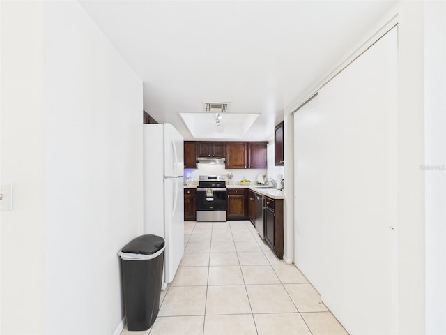 kitchen with light tile patterned floors, light countertops, visible vents, appliances with stainless steel finishes, and a sink