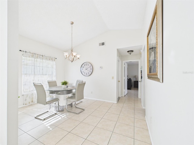 dining space featuring a notable chandelier, lofted ceiling, visible vents, light tile patterned flooring, and baseboards