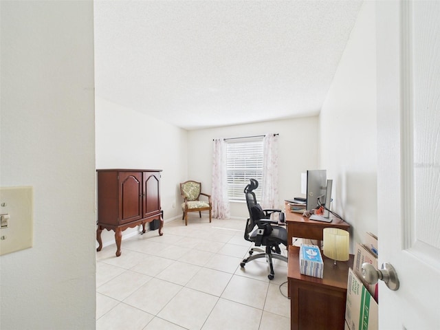 office featuring light tile patterned floors and a textured ceiling