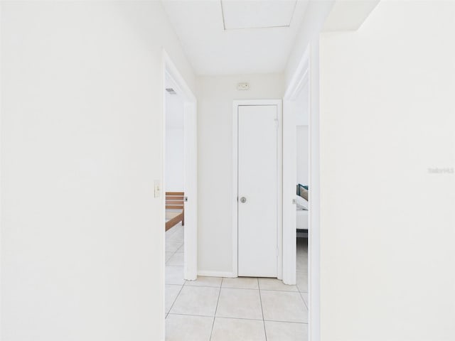 hallway featuring light tile patterned floors