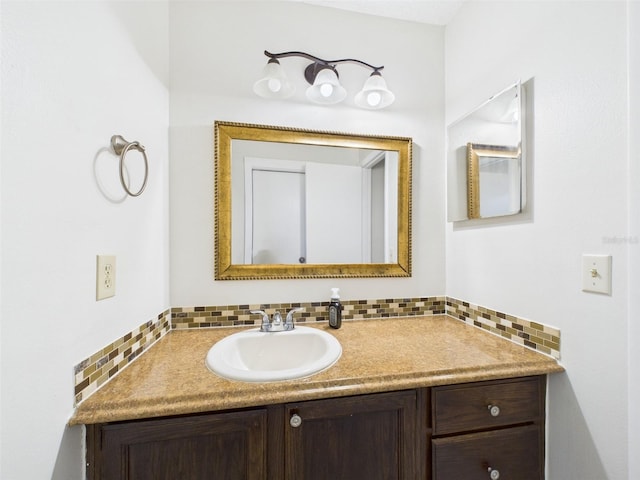 bathroom featuring tasteful backsplash and vanity