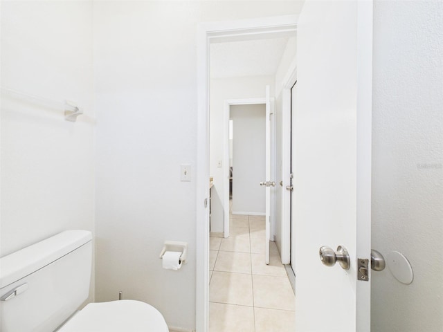 bathroom featuring tile patterned flooring and toilet