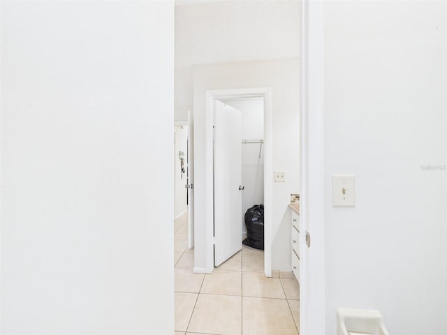 hallway with light tile patterned floors