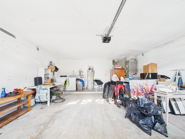 garage with independent washer and dryer, concrete block wall, electric water heater, and a garage door opener