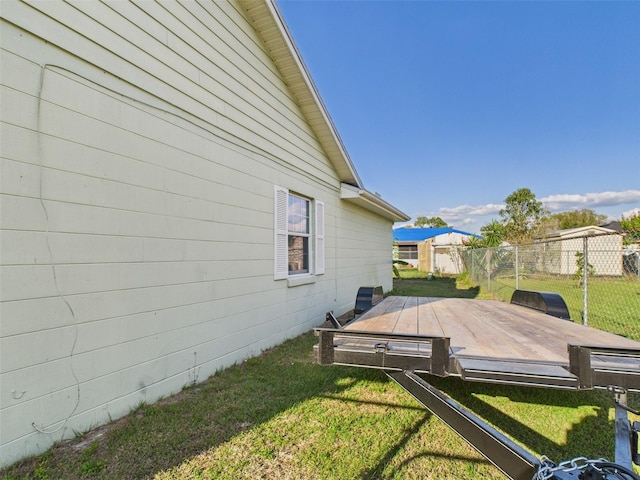 view of yard with fence and a wooden deck