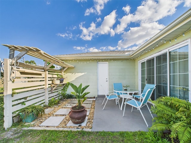 view of patio / terrace featuring fence