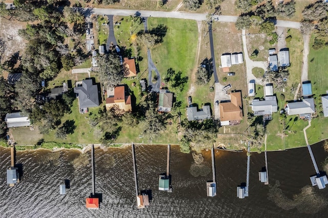 drone / aerial view with a water view and a residential view