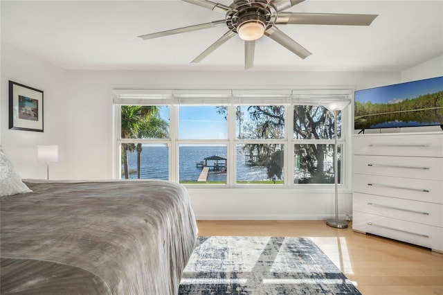 bedroom with light wood-type flooring and ceiling fan