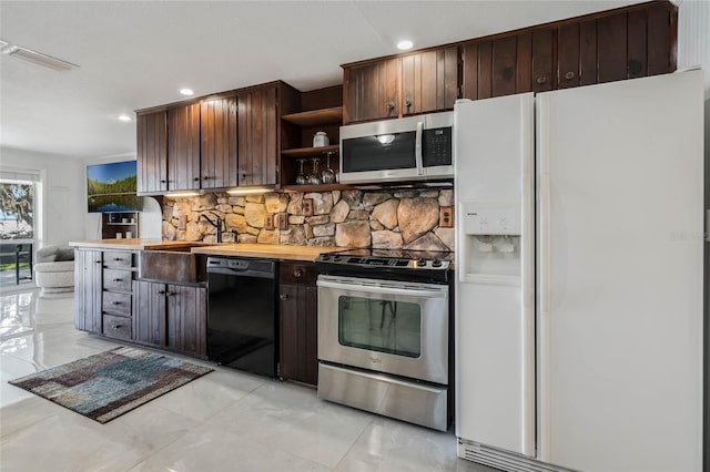 kitchen with open shelves, visible vents, decorative backsplash, appliances with stainless steel finishes, and dark brown cabinets