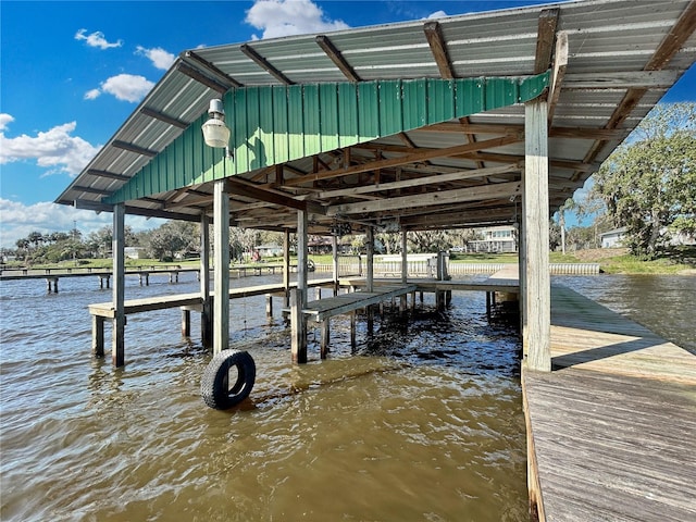 dock area featuring a water view and boat lift