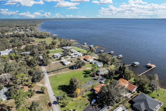 drone / aerial view featuring a water view and a residential view