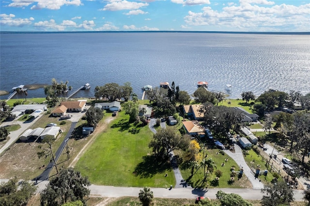 drone / aerial view with a water view and a residential view