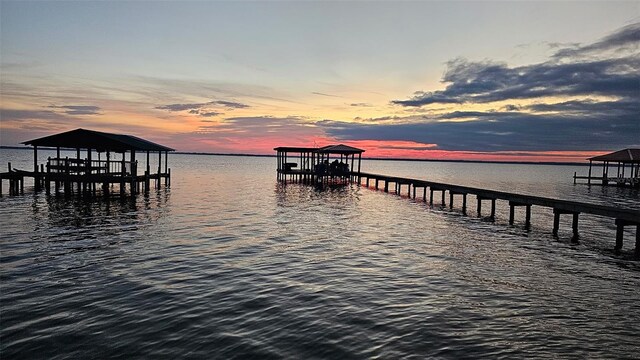 view of dock with a water view and boat lift
