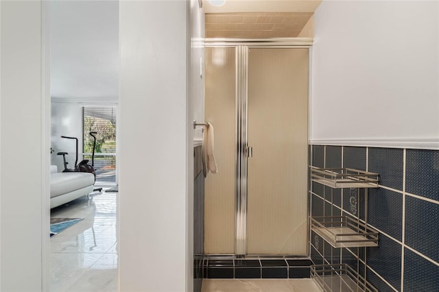 bathroom featuring tile patterned flooring and a stall shower