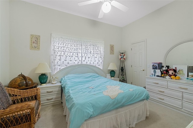 bedroom featuring light carpet and ceiling fan