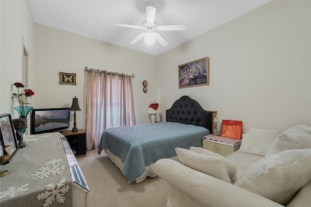 bedroom featuring a ceiling fan and light carpet