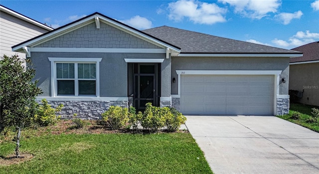 craftsman house with stucco siding, concrete driveway, a front yard, a garage, and stone siding