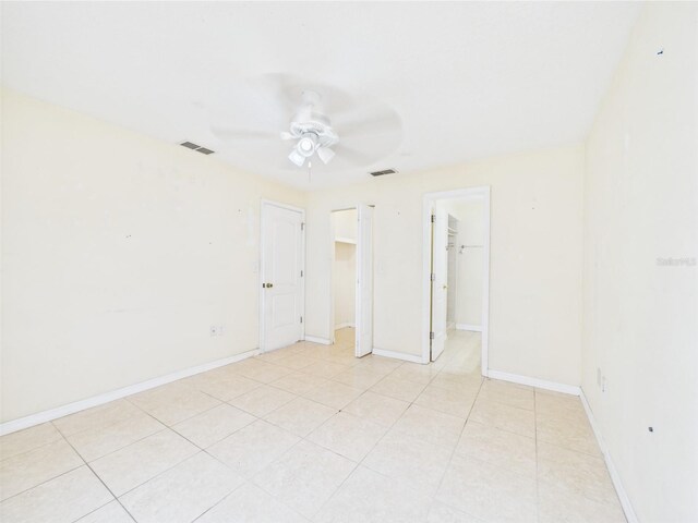 91 W Cedarwood Cir, Kissimmee, FL 34743 - spare room featuring ceiling fan, light tile patterned floors, and baseboards