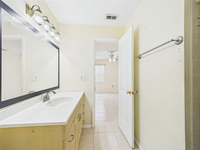 91 W Cedarwood Cir, Kissimmee, FL 34743 - bathroom featuring tile patterned flooring, a ceiling fan, vanity, and baseboards
