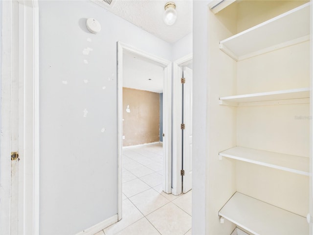 91 W Cedarwood Cir, Kissimmee, FL 34743 - hallway featuring light tile patterned floors