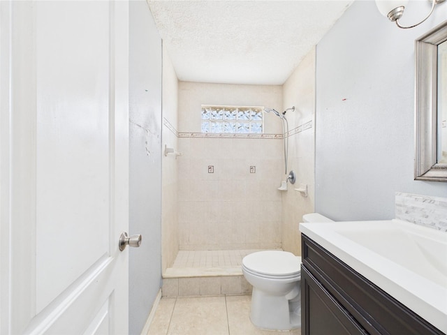 91 W Cedarwood Cir, Kissimmee, FL 34743 - bathroom with tiled shower, vanity, tile patterned flooring, and toilet