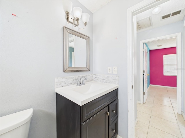 91 W Cedarwood Cir, Kissimmee, FL 34743 - half bath with tile patterned floors, vanity, and toilet