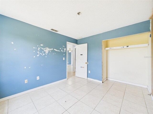 91 W Cedarwood Cir, Kissimmee, FL 34743 - unfurnished bedroom featuring baseboards and light tile patterned floors