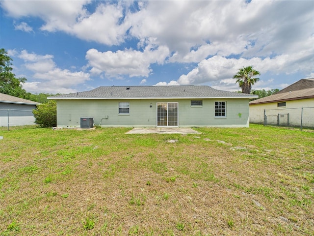 91 W Cedarwood Cir, Kissimmee, FL 34743 - rear view of house featuring central AC unit and a patio