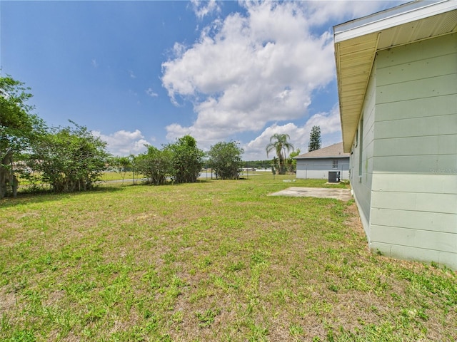 91 W Cedarwood Cir, Kissimmee, FL 34743 - view of green lawn featuring cooling unit