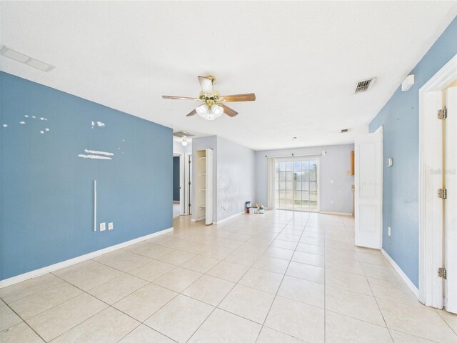 91 W Cedarwood Cir, Kissimmee, FL 34743 - empty room featuring a ceiling fan, light tile patterned floors, and baseboards