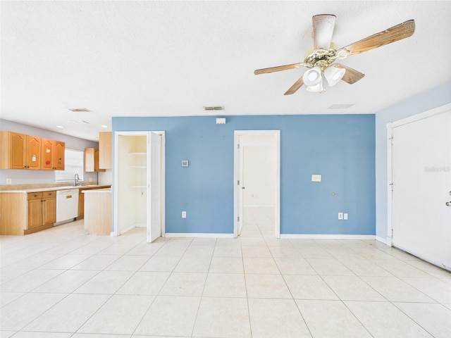 91 W Cedarwood Cir, Kissimmee, FL 34743 - unfurnished living room featuring ceiling fan, baseboards, a sink, and light tile patterned floors