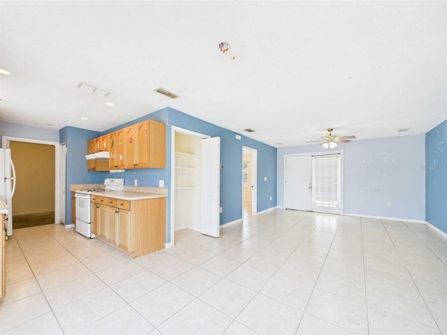 91 W Cedarwood Cir, Kissimmee, FL 34743 - kitchen with white appliances, ceiling fan, light countertops, under cabinet range hood, and light tile patterned floors