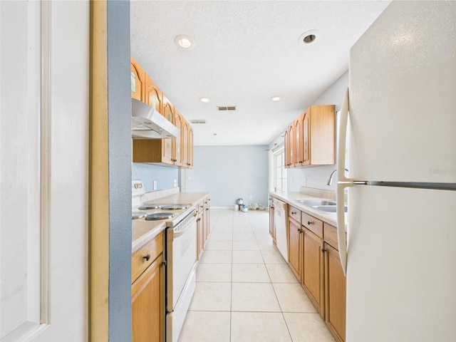 91 W Cedarwood Cir, Kissimmee, FL 34743 - kitchen with white appliances, a sink, under cabinet range hood, light countertops, and light tile patterned floors