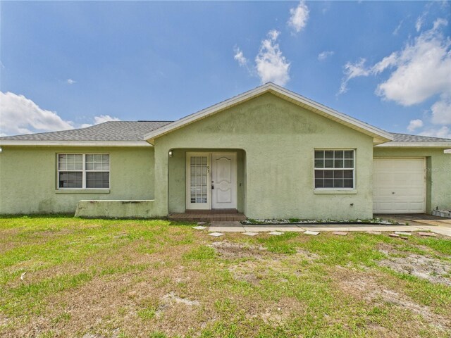 91 W Cedarwood Cir, Kissimmee, FL 34743 - ranch-style house with stucco siding, an attached garage, a front lawn, and roof with shingles