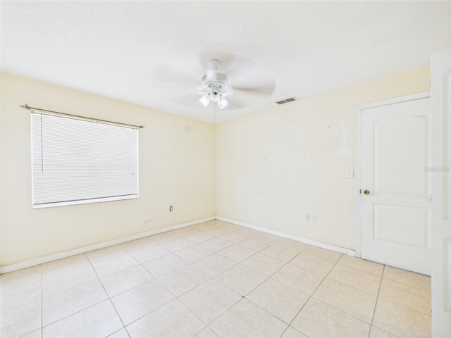 91 W Cedarwood Cir, Kissimmee, FL 34743 - spare room with ceiling fan, light tile patterned flooring, and baseboards