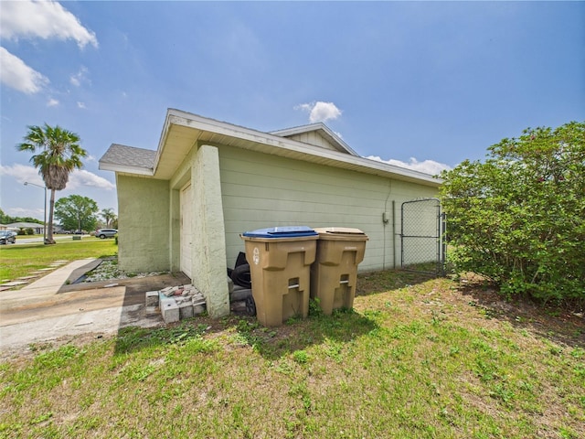 91 W Cedarwood Cir, Kissimmee, FL 34743 - view of side of home with a gate
