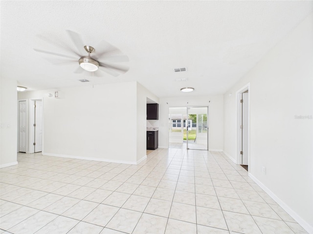 2434 Mill Run Blvd, Kissimmee, FL 34744 - unfurnished room featuring a ceiling fan, baseboards, visible vents, and light tile patterned flooring
