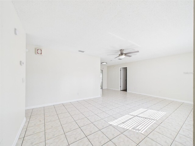 2434 Mill Run Blvd, Kissimmee, FL 34744 - spare room with light tile patterned floors, baseboards, visible vents, and ceiling fan