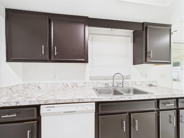 2434 Mill Run Blvd, Kissimmee, FL 34744 - kitchen with a sink, dark brown cabinetry, light countertops, and dishwasher