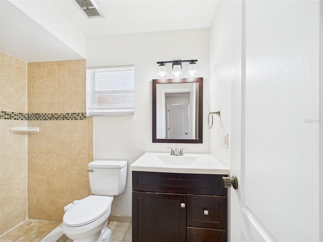 2434 Mill Run Blvd, Kissimmee, FL 34744 - full bath featuring vanity, toilet, visible vents, and a tile shower