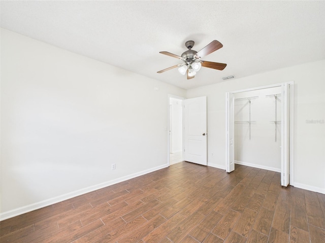 2434 Mill Run Blvd, Kissimmee, FL 34744 - unfurnished bedroom with wood finished floors, a ceiling fan, a closet, visible vents, and baseboards