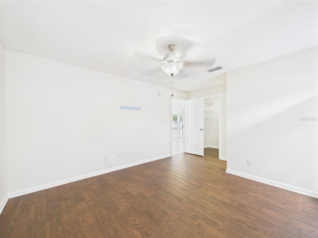 2434 Mill Run Blvd, Kissimmee, FL 34744 - spare room featuring ceiling fan, dark wood-style flooring, baseboards, and visible vents