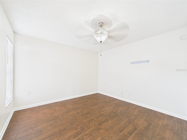 2434 Mill Run Blvd, Kissimmee, FL 34744 - empty room featuring dark wood-type flooring, baseboards, and ceiling fan