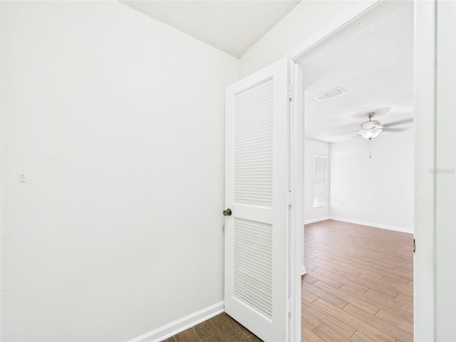 2434 Mill Run Blvd, Kissimmee, FL 34744 - corridor with visible vents, baseboards, and dark wood-style floors