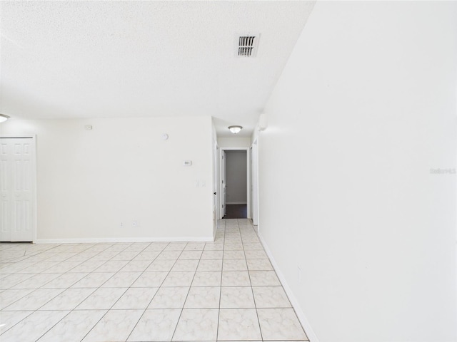 2434 Mill Run Blvd, Kissimmee, FL 34744 - empty room featuring light tile patterned floors, baseboards, and visible vents