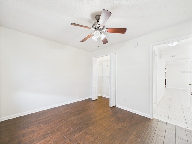 2434 Mill Run Blvd, Kissimmee, FL 34744 - empty room with a ceiling fan, baseboards, and wood finished floors