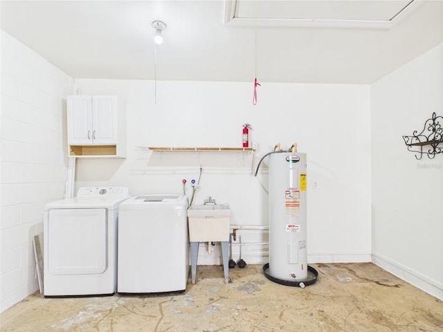 2434 Mill Run Blvd, Kissimmee, FL 34744 - clothes washing area featuring attic access, a sink, washing machine and clothes dryer, water heater, and cabinet space