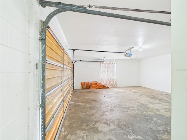 2434 Mill Run Blvd, Kissimmee, FL 34744 - garage with concrete block wall and a garage door opener