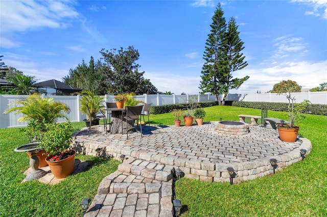 view of patio featuring a fire pit and a fenced backyard